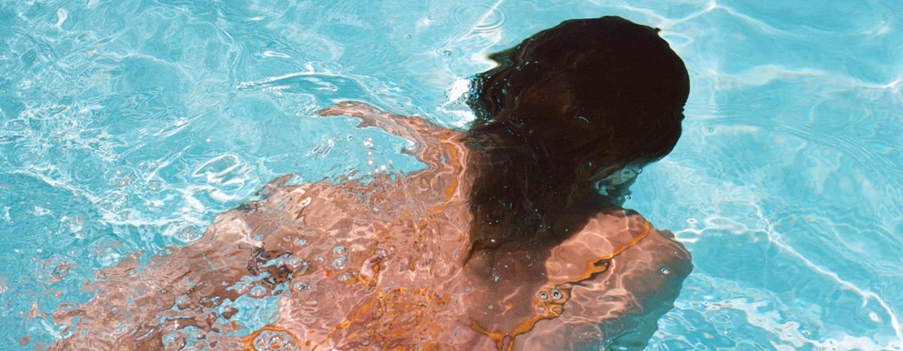 woman swimming underwater